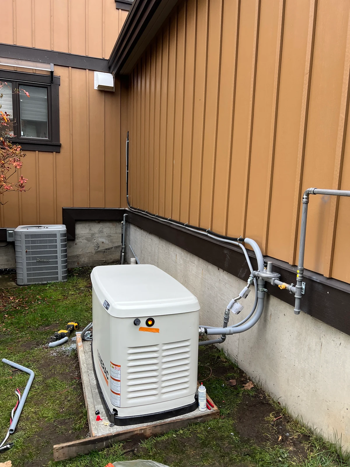 Outdoor standby generator beside the Belcarra home