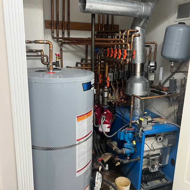 Separate boiler and storage tank shown in the Richmond heating and hot-water project source photo